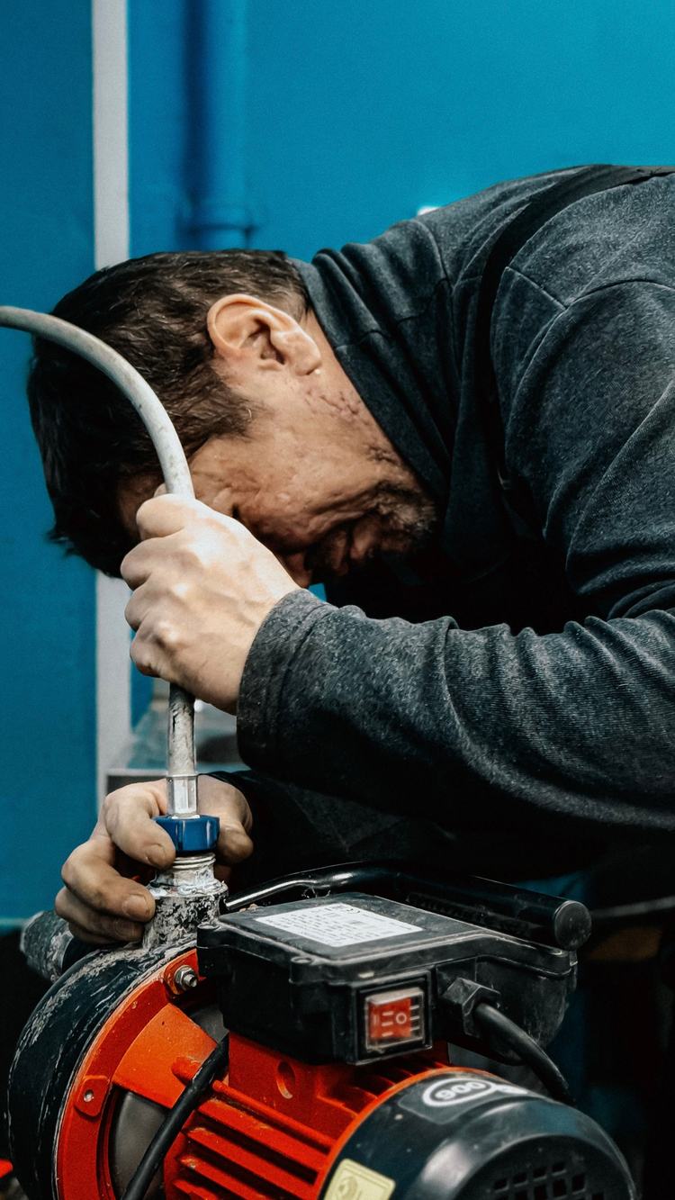 Technician working on a red water pump